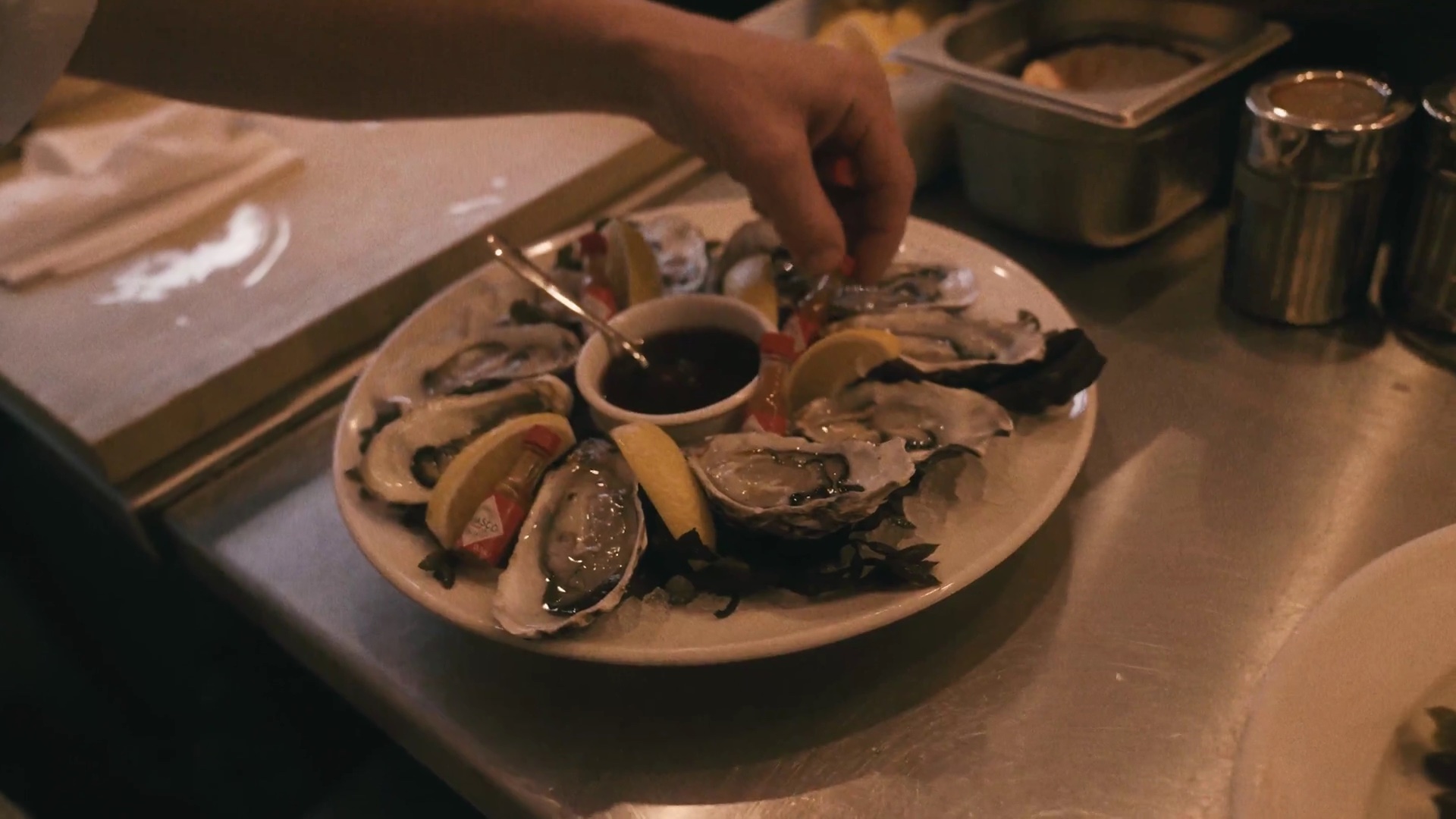 A plate of freshly shucked oysters on the half shell with lemon at Applebee's counter, Borough Market